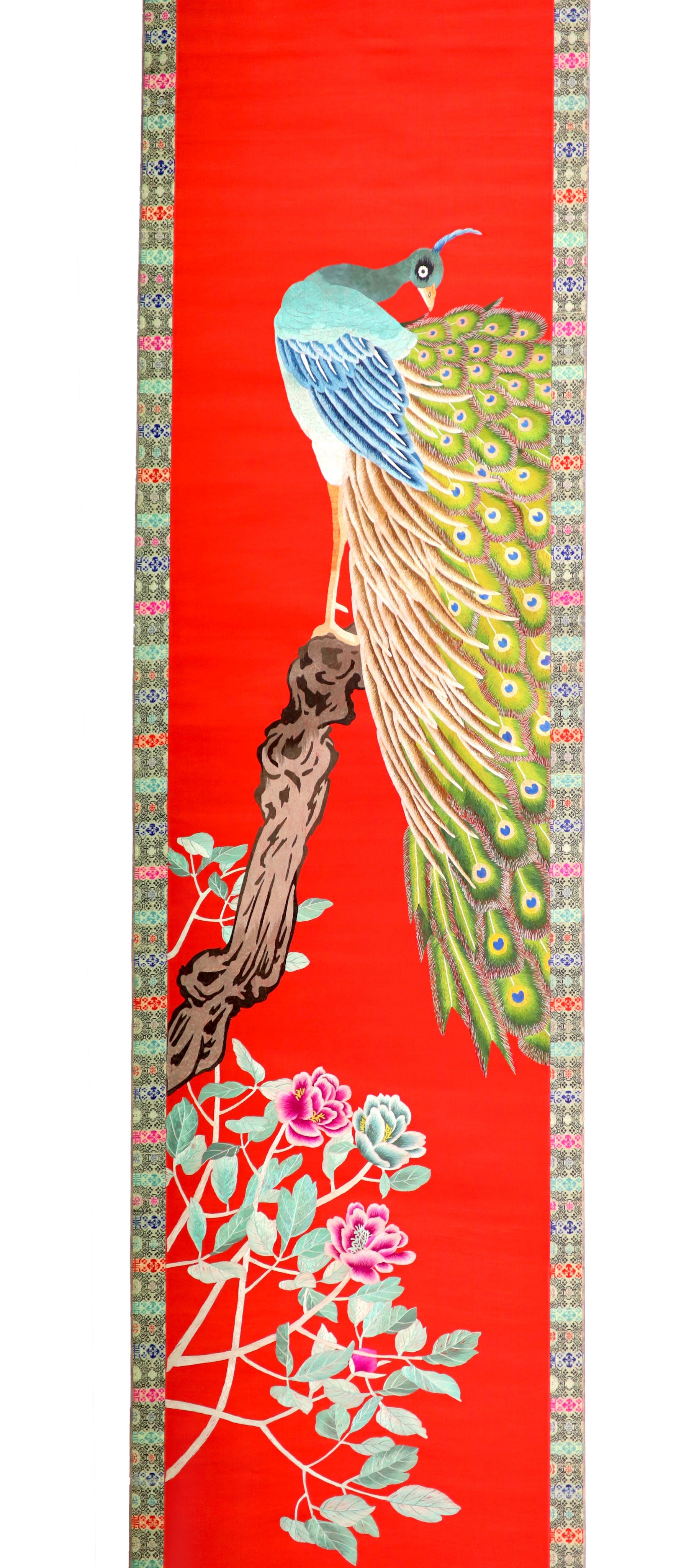 A Chinese embroidered silk ‘peacock’ scroll, late 19th century, 194 x 45 cm excluding brocade borders